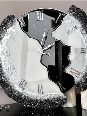 Black with silver uneven clock